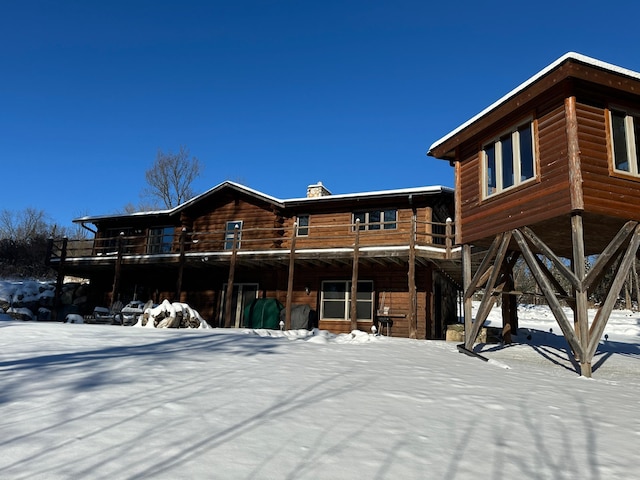 view of snow covered property