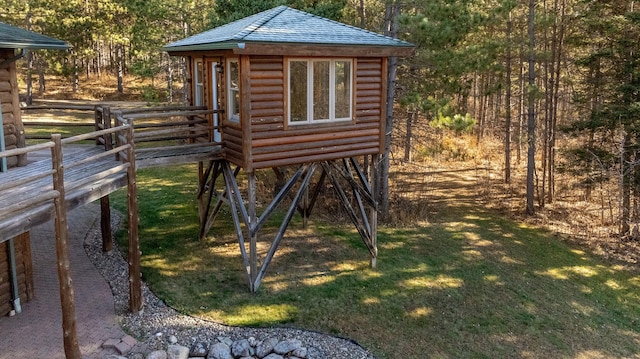 view of outbuilding featuring a lawn