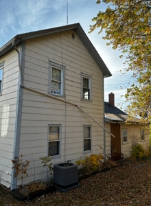 view of home's exterior with central AC