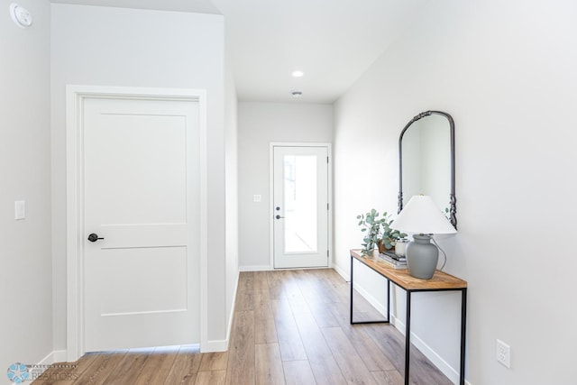 entryway with light hardwood / wood-style floors