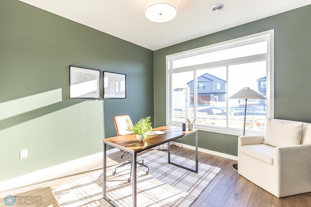 office space with light hardwood / wood-style floors