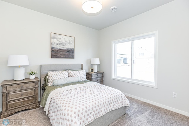 bedroom featuring light colored carpet