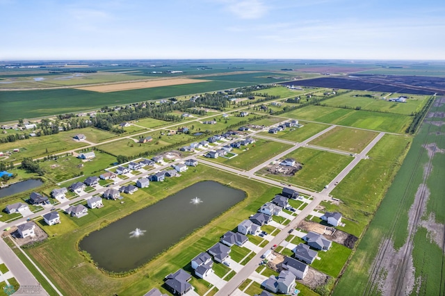 drone / aerial view featuring a water view and a rural view