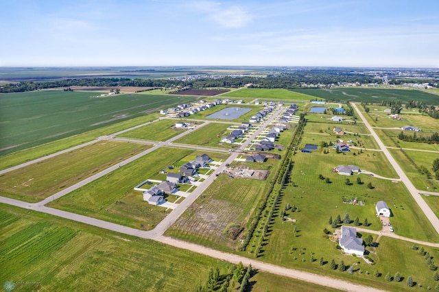 birds eye view of property with a rural view