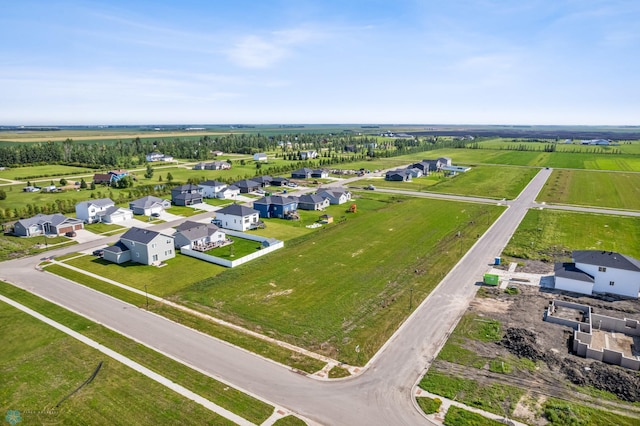 birds eye view of property with a rural view