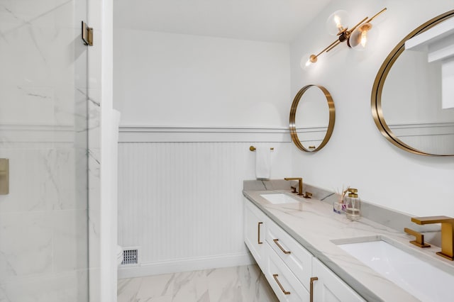 4756 Kildare Rd, Mound, MN 55364 - bathroom with double vanity, marble finish floors, a shower stall, and wainscoting