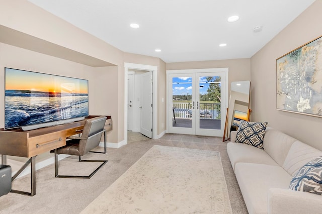 carpeted office featuring french doors