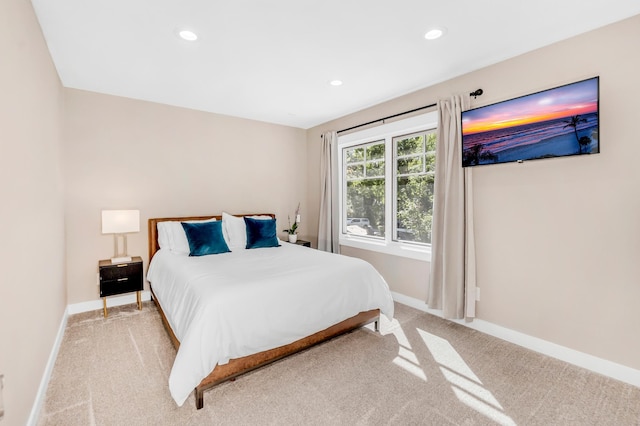 bedroom with light colored carpet