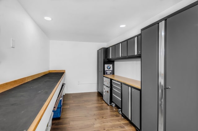 kitchen with gray cabinets and dark hardwood / wood-style flooring