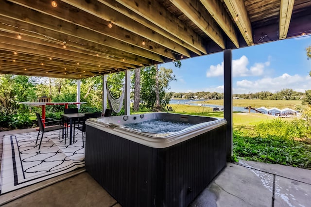 4756 Kildare Rd, Mound, MN 55364 - view of patio / terrace with a hot tub, a water view, and view of wooded area