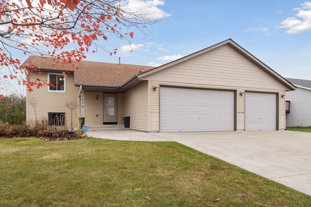 view of front facade featuring a front yard and a garage