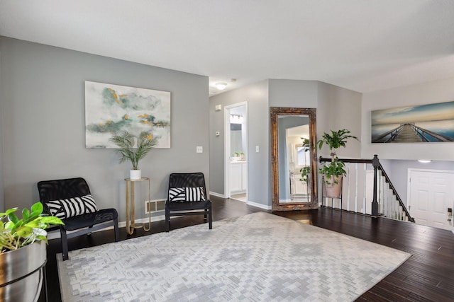 living area with hardwood / wood-style floors