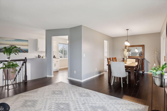 dining space featuring dark hardwood / wood-style floors