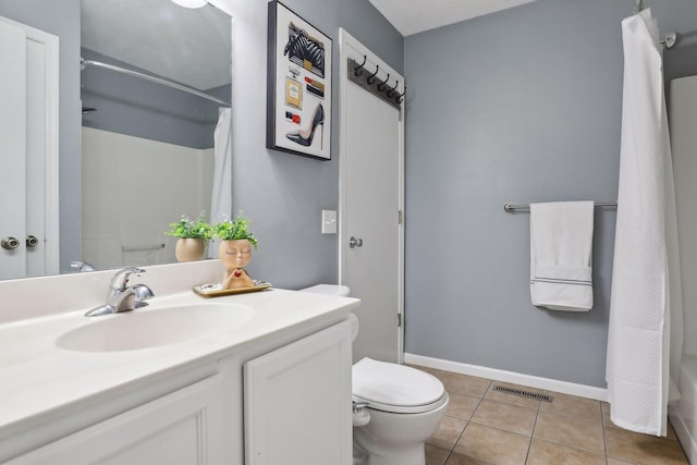 full bathroom featuring tile patterned floors, vanity, shower / bath combination with curtain, and toilet