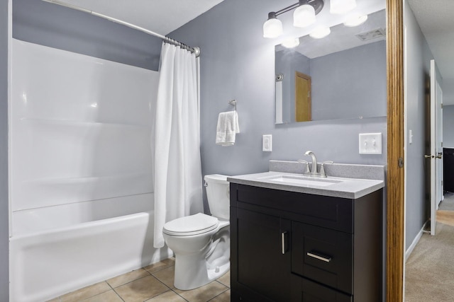 full bathroom featuring tile patterned flooring, vanity, toilet, and shower / bath combo with shower curtain