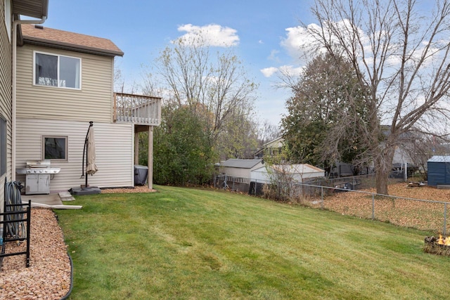 view of yard with a balcony