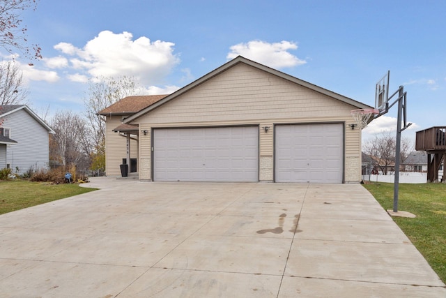 garage featuring a lawn