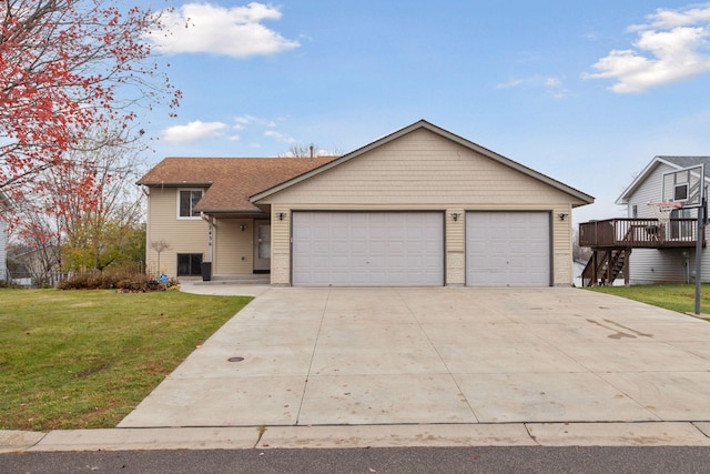 view of front of house with a garage, a wooden deck, and a front yard