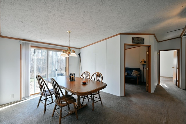 dining room with dark colored carpet, a textured ceiling, and vaulted ceiling