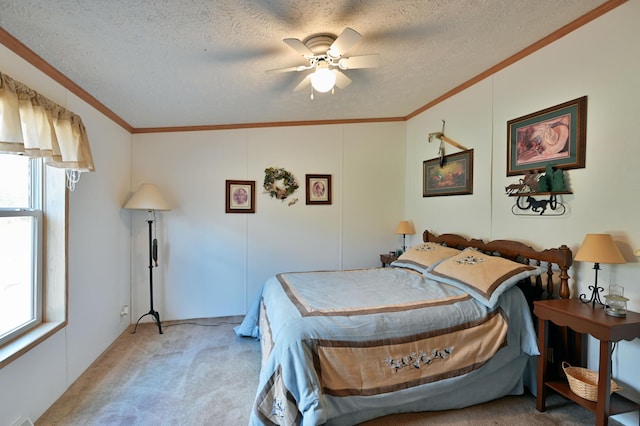 carpeted bedroom with a textured ceiling, multiple windows, crown molding, and ceiling fan