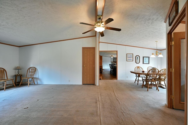 unfurnished living room with carpet, ceiling fan with notable chandelier, a textured ceiling, vaulted ceiling, and crown molding