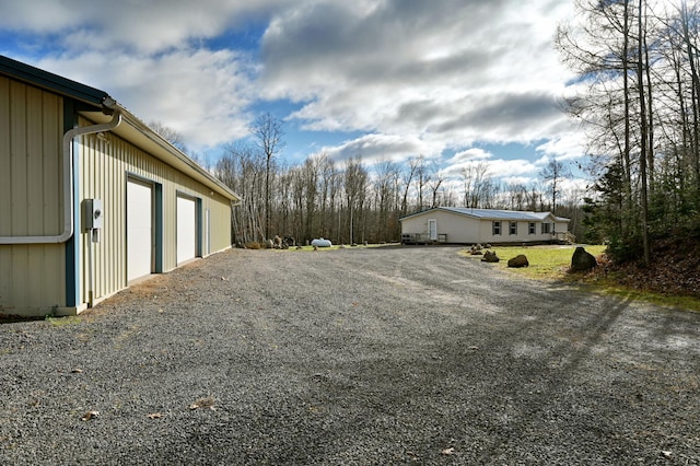 view of yard featuring a garage