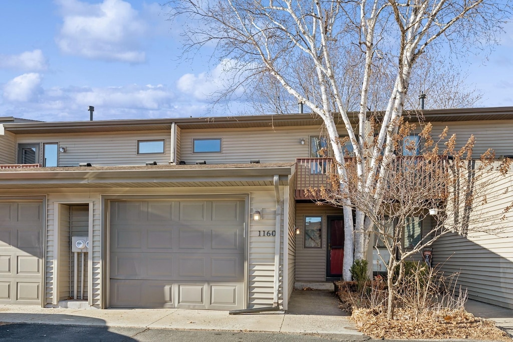 multi unit property featuring a garage