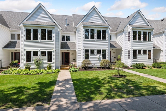 5006 Sheridan Ave S, Minneapolis, MN 55410 - view of property with a shingled roof and a front yard
