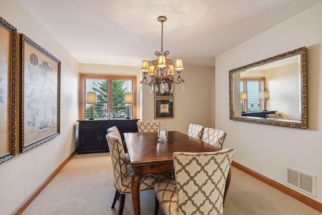 5006 Sheridan Ave S, Minneapolis, MN 55410 - dining area with a chandelier, light colored carpet, and baseboards