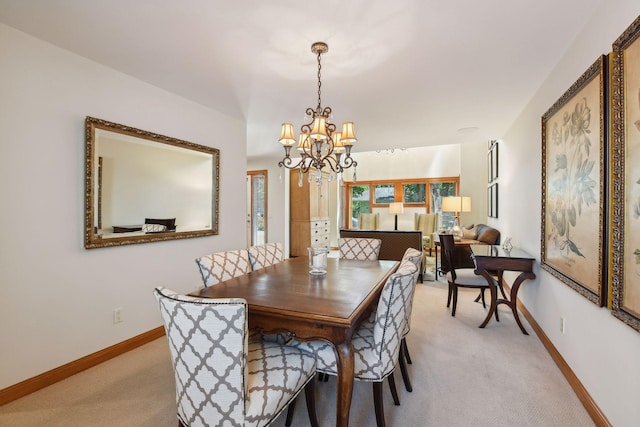 5006 Sheridan Ave S, Minneapolis, MN 55410 - dining room featuring light colored carpet, a chandelier, and baseboards