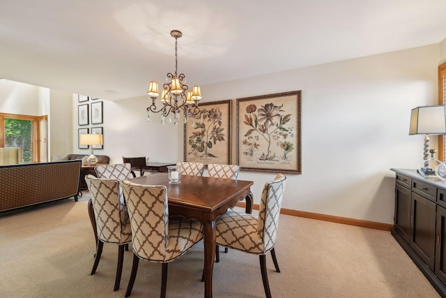 5006 Sheridan Ave S, Minneapolis, MN 55410 - dining room featuring light colored carpet, a chandelier, and baseboards