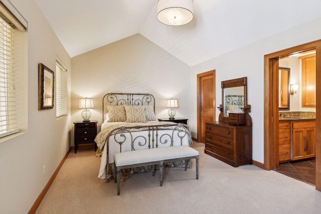 5006 Sheridan Ave S, Minneapolis, MN 55410 - carpeted bedroom with a sink, vaulted ceiling, baseboards, and ensuite bathroom