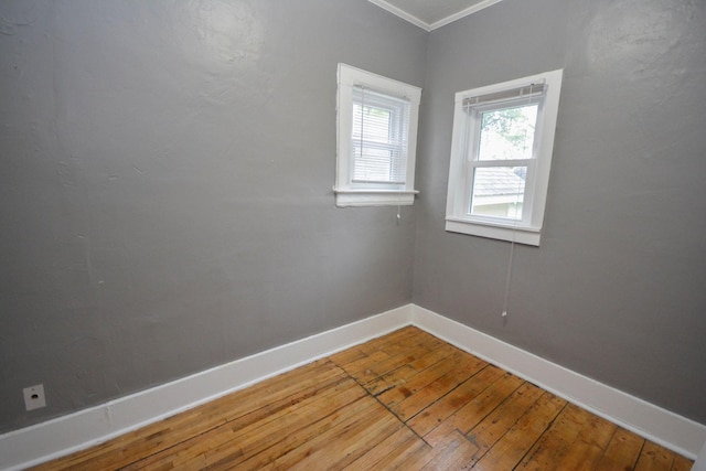 107 3rd Ave SW, Austin, MN 55912 - empty room featuring crown molding and wood-type flooring