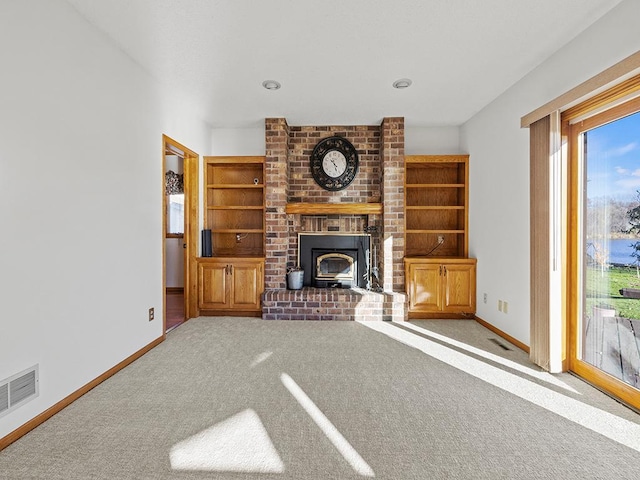 unfurnished living room with light colored carpet