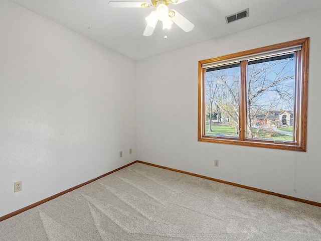 carpeted empty room with ceiling fan