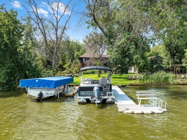 dock area with a gazebo and a water view