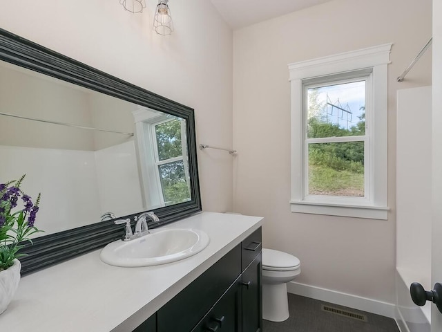 full bathroom with vanity, toilet, tub / shower combination, and a wealth of natural light