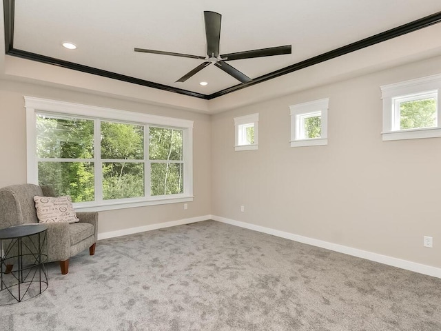 unfurnished room featuring ceiling fan, ornamental molding, and carpet floors