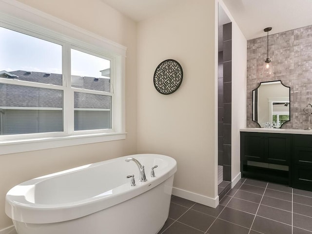 bathroom with tile patterned floors, plus walk in shower, and vanity