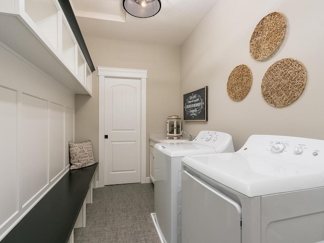 washroom featuring washer and dryer and sink