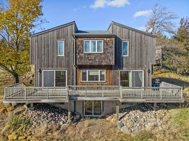 back of house with a wooden deck