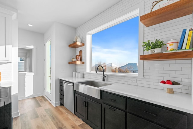 kitchen featuring tasteful backsplash, a mountain view, sink, and stainless steel dishwasher