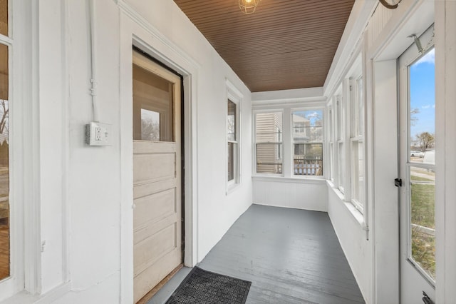 unfurnished sunroom with wood ceiling