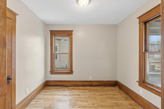 spare room with light hardwood / wood-style flooring