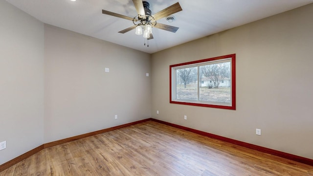 unfurnished room with light wood-style flooring, baseboards, and ceiling fan