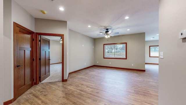 empty room with recessed lighting, ceiling fan, and light wood finished floors