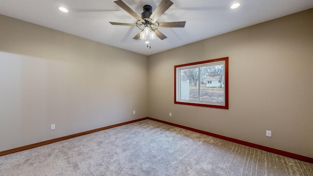 spare room featuring recessed lighting, carpet flooring, a ceiling fan, and baseboards