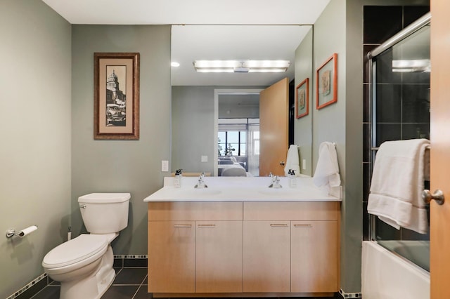 full bathroom featuring vanity, tile patterned flooring, enclosed tub / shower combo, and toilet