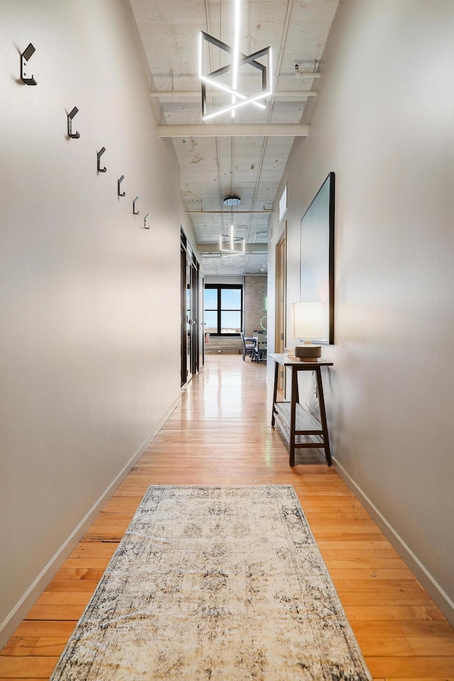 corridor featuring hardwood / wood-style floors