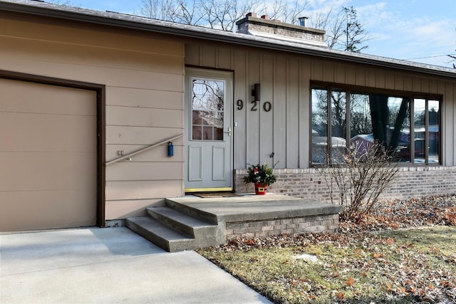 doorway to property featuring a garage